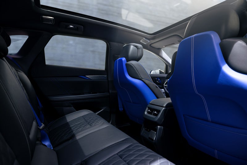 Back Seat View of the 2026 OPTIQ-V Blue Front Seats, Sun Roof, and Interior | Johnson Cadillac in BUDD LAKE NJ